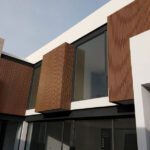House facade using fluted panels